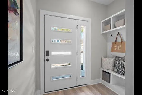 a view of a hallway with front door