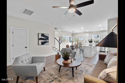 2126 Titanium Rock Road Durham, NC 27704 - Photo 7 of 20 a living room with furniture and a dining table