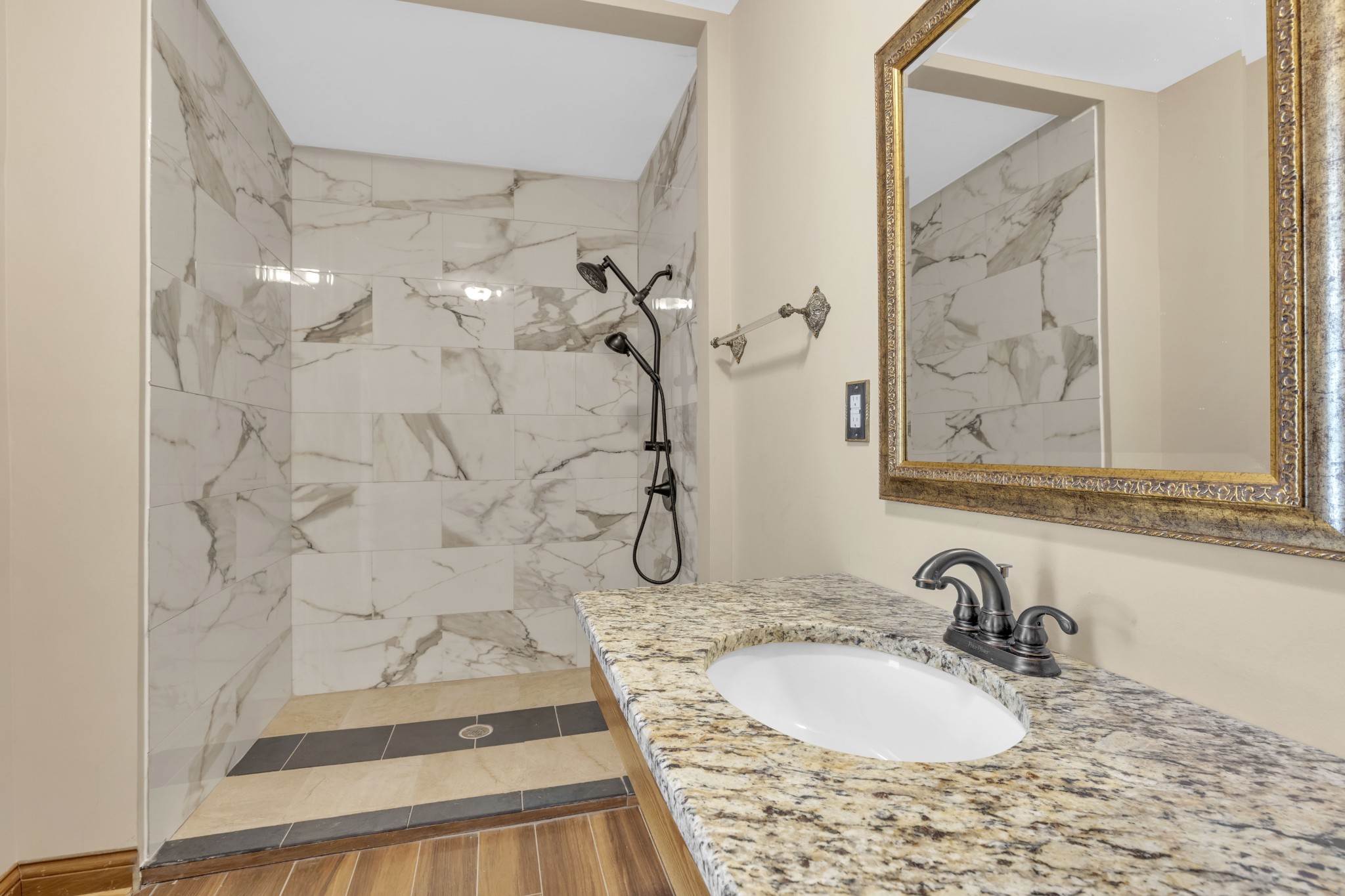 115 North Main Street Springfield, TN 37172 - Photo 24 of 24 a bathroom with a granite countertop sink a mirror and shower