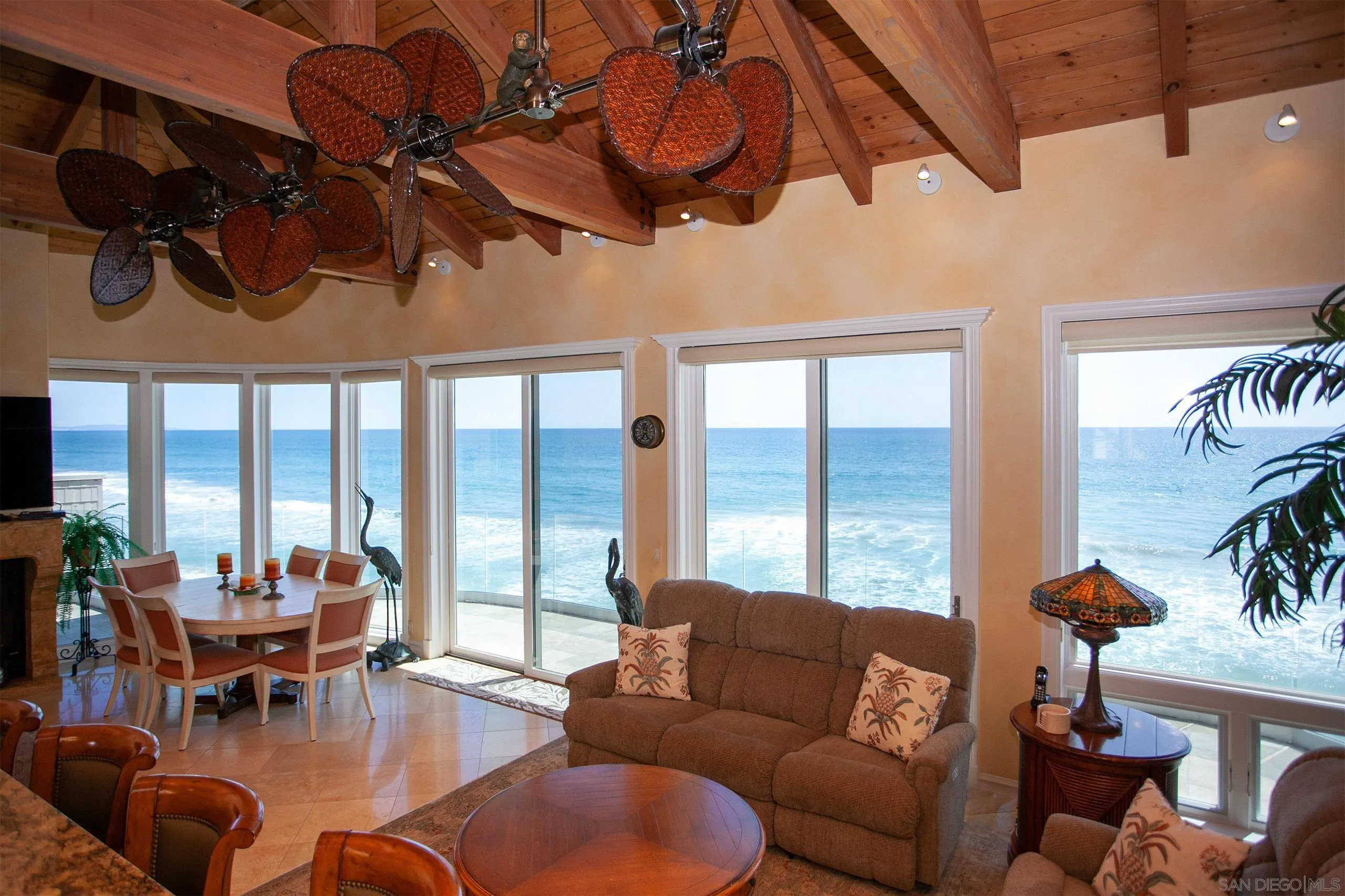 2901 Ocean Street, Unit 3 Carlsbad, CA 92008 - Photo 12 of 29 a living room with furniture and floor to ceiling windows