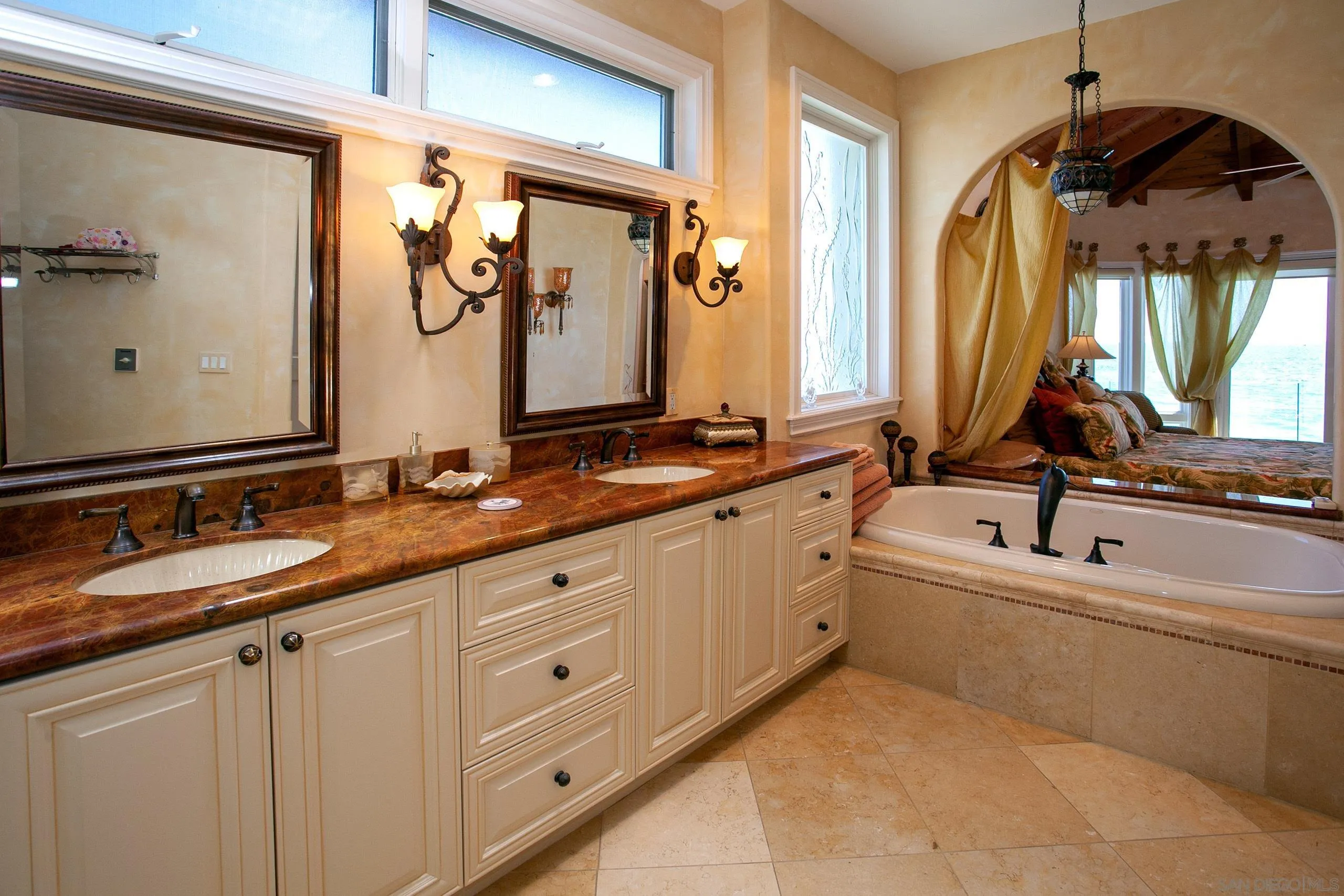 2901 Ocean Street, Unit 3 Carlsbad, CA 92008 - Photo 17 of 29 a bathroom with double sink and a mirror