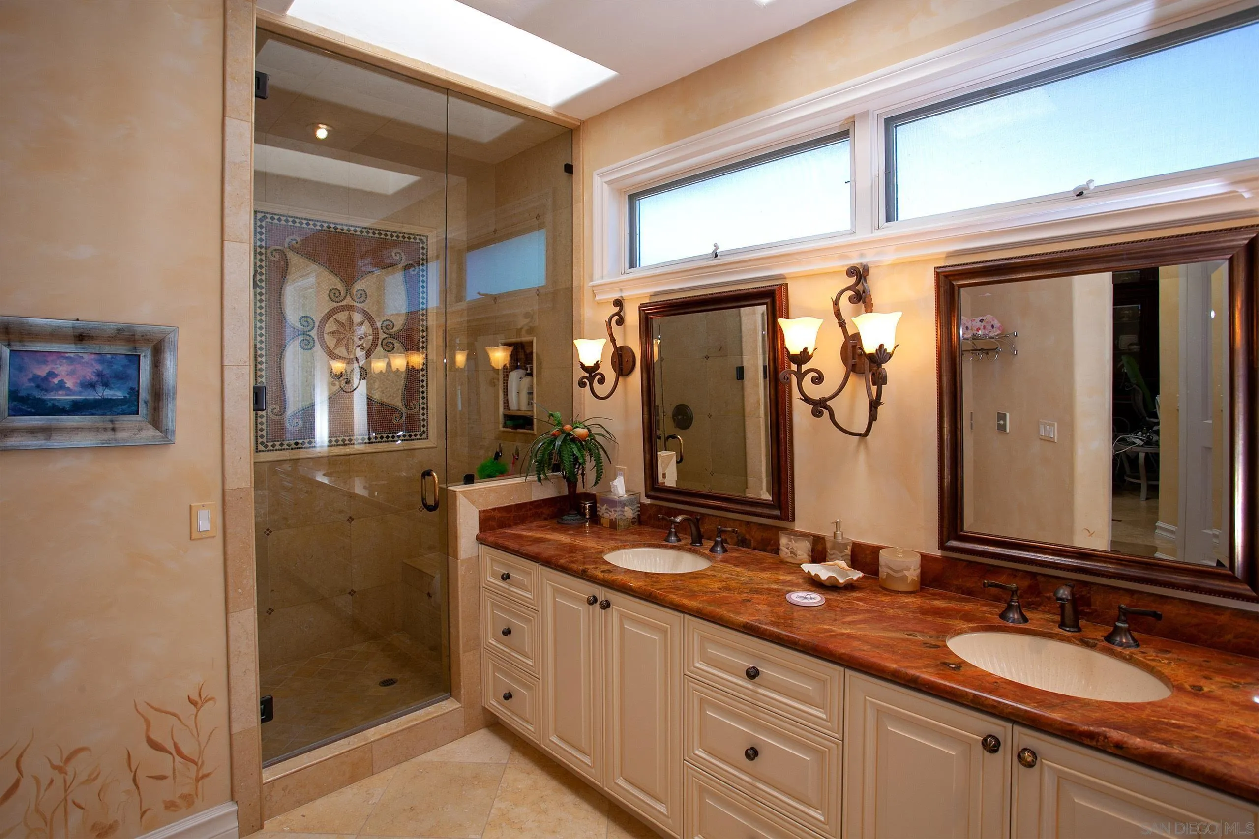2901 Ocean Street, Unit 3 Carlsbad, CA 92008 - Photo 18 of 29 a bathroom with double vanity and a mirror