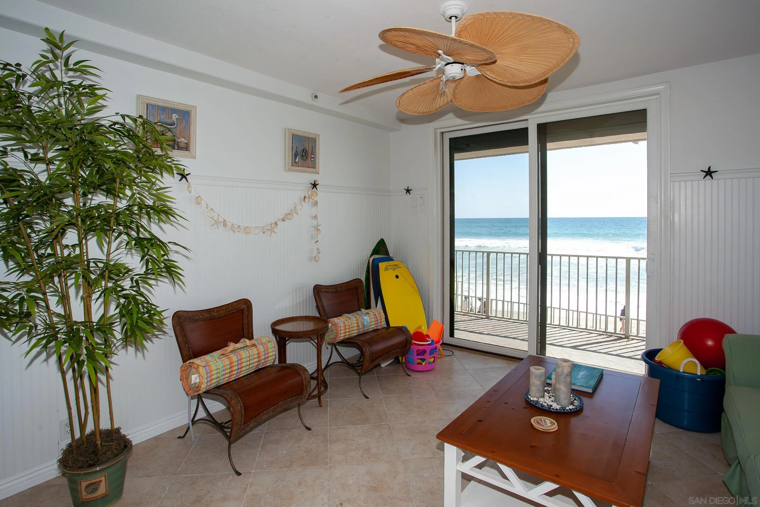 2901 Ocean Street, Unit 3 Carlsbad, CA 92008 - Photo 23 of 29 a living room with furniture and a potted plant