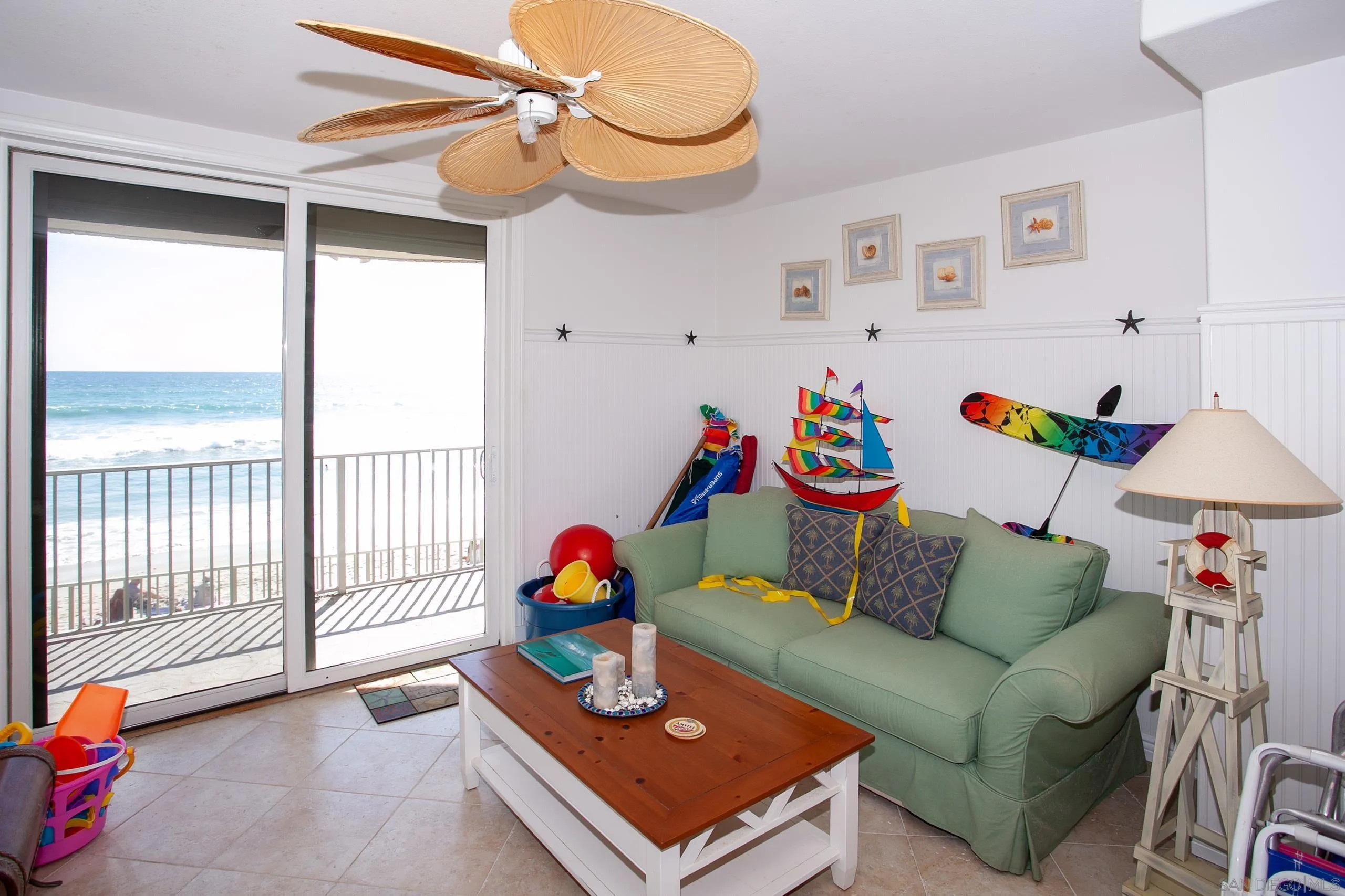 2901 Ocean Street, Unit 3 Carlsbad, CA 92008 - Photo 24 of 29 a living room with furniture and a window