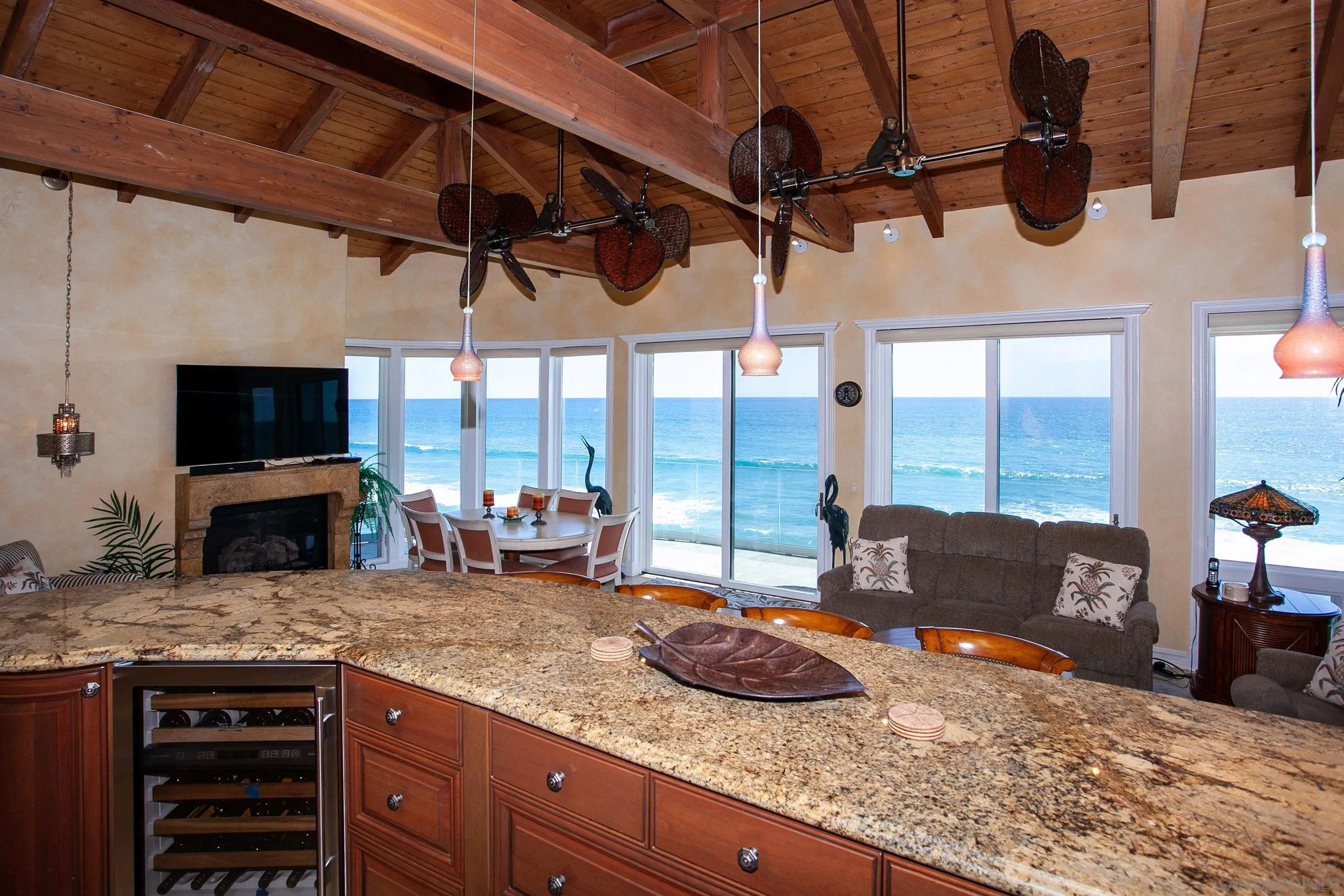 2901 Ocean Street, Unit 3 Carlsbad, CA 92008 - Photo 5 of 29 a kitchen with a stove a sink and a wooden cabinets