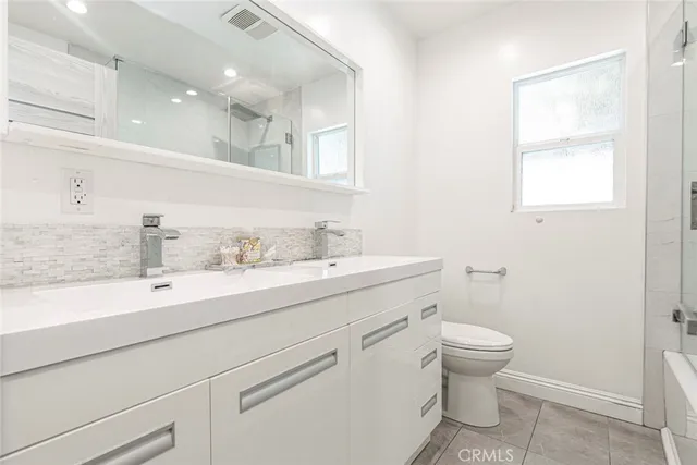 a bathroom with a tub and a shower