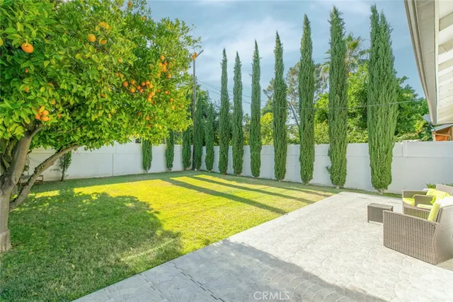 a house with swimming pool in front of it