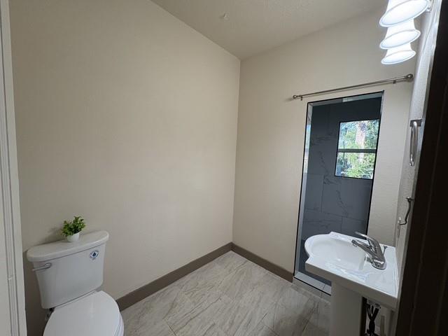 4876 East Williams Spring Road Fort Worth, TX 76135 - Photo 15 of 20 a bathroom with a toilet