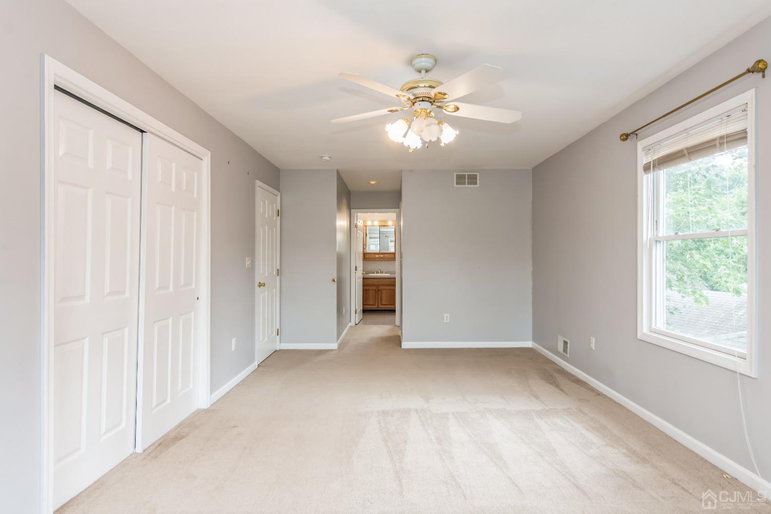 640 Bound Brook Road Middlesex, NJ 08846 - Photo 13 of 23 a view of an empty room with chandelier fan and fire place