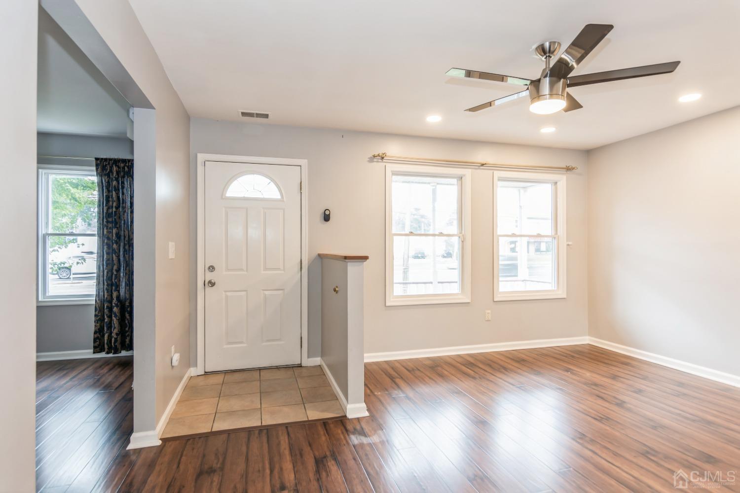 640 Bound Brook Road Middlesex, NJ 08846 - Photo 3 of 23 wooden floor in an empty room with a window