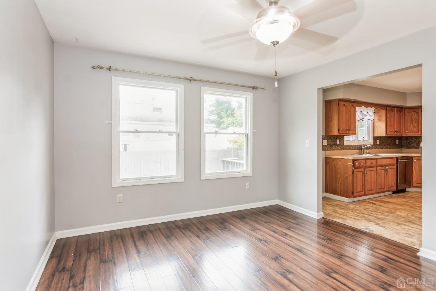 640 Bound Brook Road Middlesex, NJ 08846 - Photo 7 of 23 a view of a kitchen with a sink wooden floor and a window