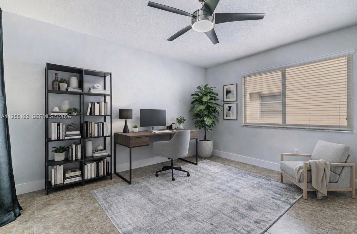 901 Northwest 22nd Place Miami, FL 33125 - Photo 21 of 52 a workspace with a bookshelf