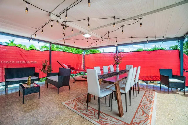 a view of a red chairs in front of house