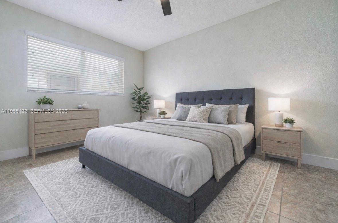 901 Northwest 22nd Place Miami, FL 33125 - Photo 33 of 52 a bedroom with a bed and window