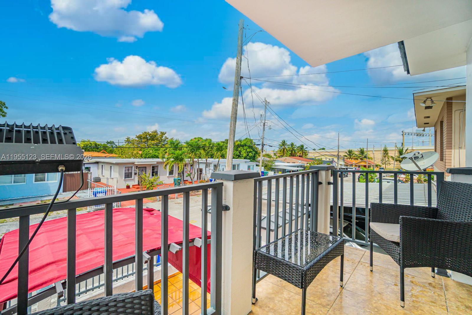 901 Northwest 22nd Place Miami, FL 33125 - Photo 36 of 52 a view of a balcony with chairs