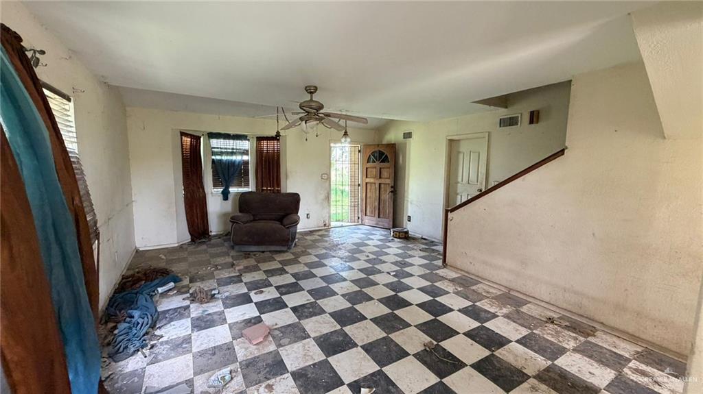 1524 West Hi Line Road Pharr, TX 78577 - Photo 25 of 34 a living room with a black white checkered floor with a black white checkered floor