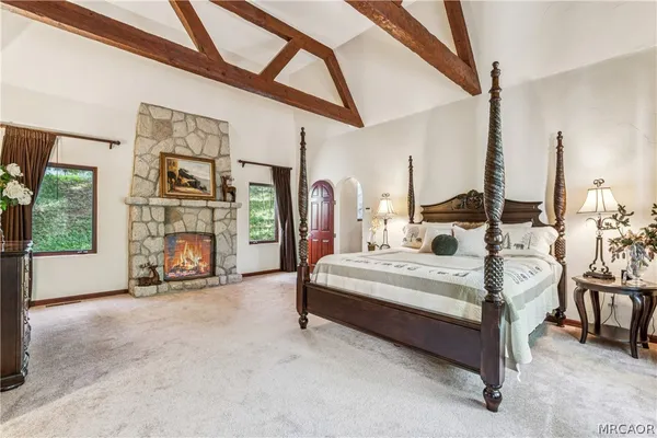 a bathroom with a tub sink and glass door