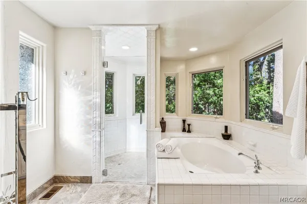 a bathroom with double vanity sinks and a mirror