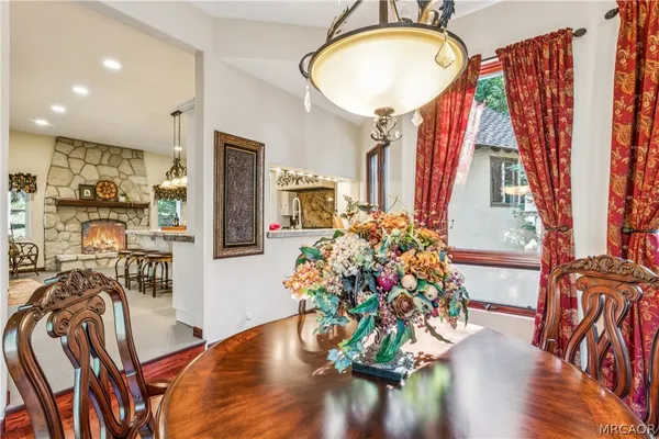 a large kitchen with a table and chairs in it