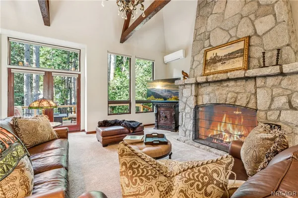 a bedroom with furniture and a fireplace