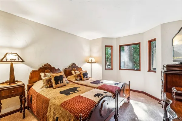 a spacious bathroom with a glass door shower and a mirror