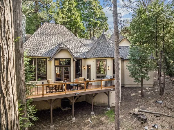 a view of a backyard with large trees