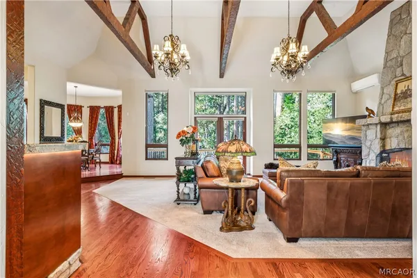 a view of living room with furniture and book shelf