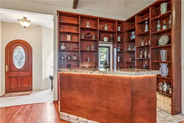 a view of a room with furniture and floor to ceiling windows