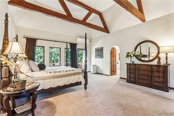 a view of living room with furniture and a fireplace