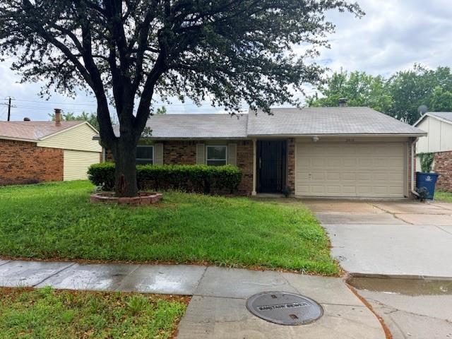 3410 Maple Lane Rowlett, TX 75089 - Photo 2 of 8 a front view of a house with garden
