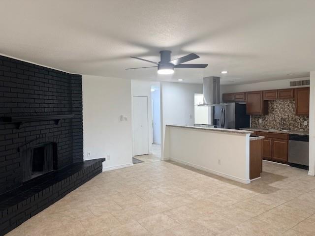 3410 Maple Lane Rowlett, TX 75089 - Photo 3 of 8 a large kitchen with kitchen island a sink stainless steel appliances and cabinets