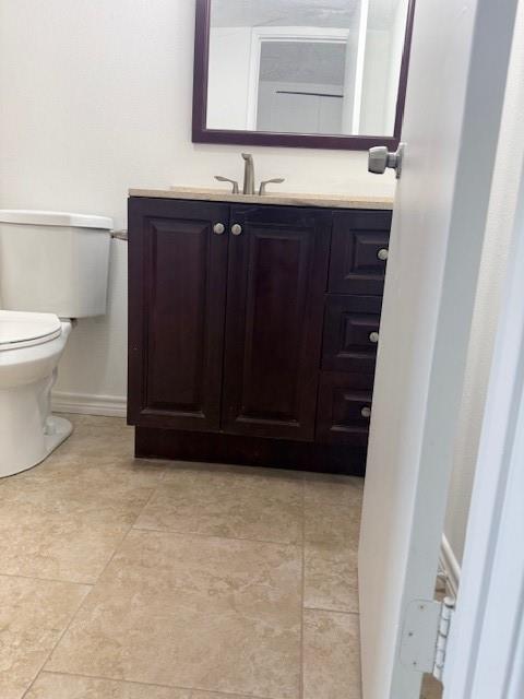 3410 Maple Lane Rowlett, TX 75089 - Photo 7 of 8 a bathroom with a sink and a toilet