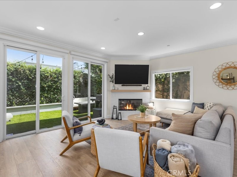 1729 Haynes Lane Redondo Beach, CA 90278 - Photo 14 of 44 a living room with furniture a fireplace and a large window with outer view