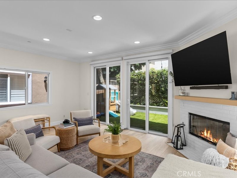 1729 Haynes Lane Redondo Beach, CA 90278 - Photo 15 of 44 a living room with furniture fireplace and a flat screen tv