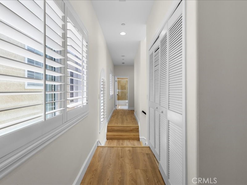 1729 Haynes Lane Redondo Beach, CA 90278 - Photo 34 of 44 a view of a hallway with wooden floor and staircase