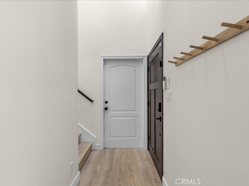 1729 Haynes Lane Redondo Beach, CA 90278 - Photo 38 of 44 a view of a hallway with wooden floor and entryway