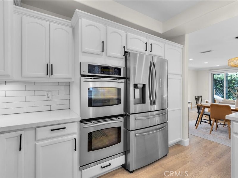 1729 Haynes Lane Redondo Beach, CA 90278 - Photo 9 of 44 a kitchen with stainless steel appliances a refrigerator stove and microwave