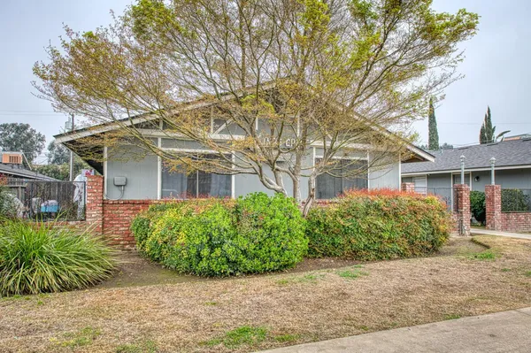 front view of a house with a garden