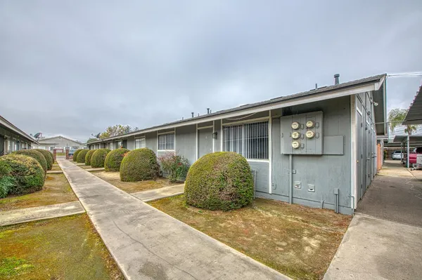 a front view of a house with garden