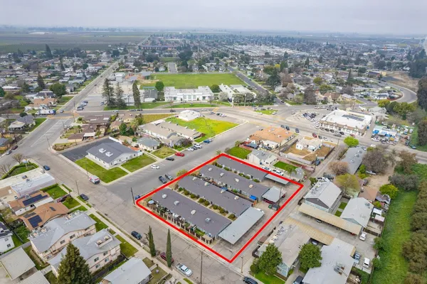 an aerial view of residential houses with outdoor space