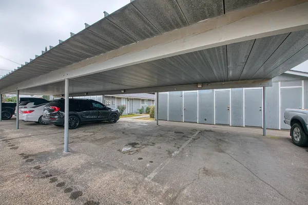 a view of parking garage with parked cars