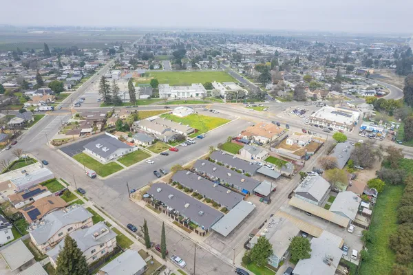 an aerial view of residential houses with outdoor space