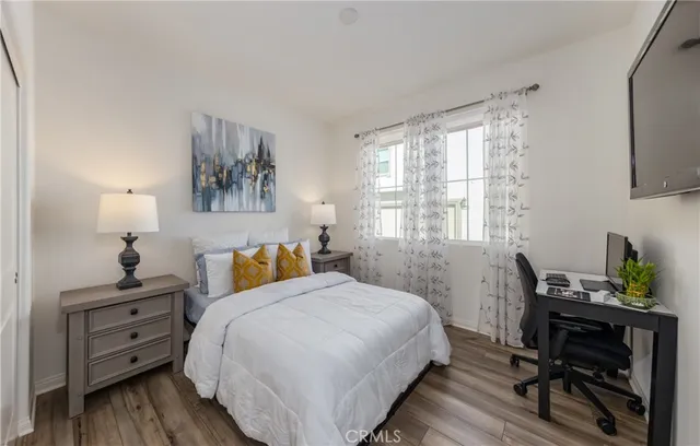 a bedroom with a bed and a table in it