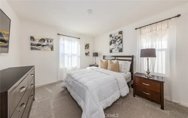 a bedroom with a bed and a cabinets