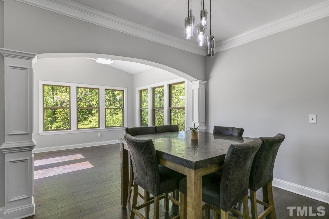 8340 Yellow Aster Court Willow Spring, NC 27592 - Photo 11 of 35 a view of a dining room with furniture window and outside view