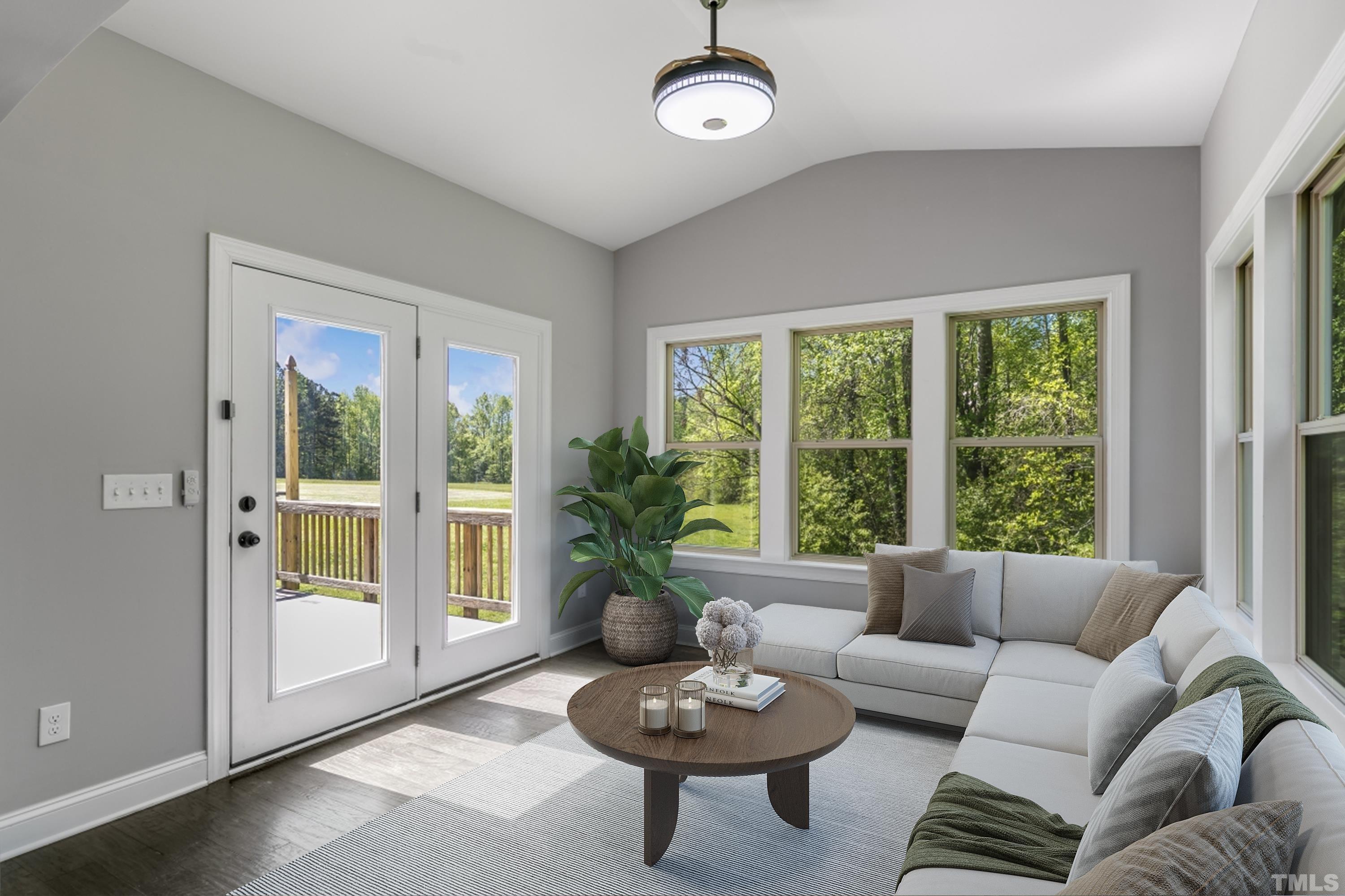 8340 Yellow Aster Court Willow Spring, NC 27592 - Photo 12 of 35 a living room with furniture and a large window
