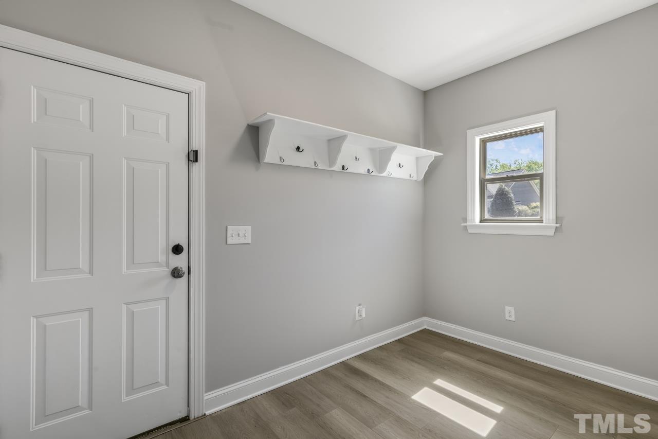 8340 Yellow Aster Court Willow Spring, NC 27592 - Photo 17 of 35 an empty room with a workbench