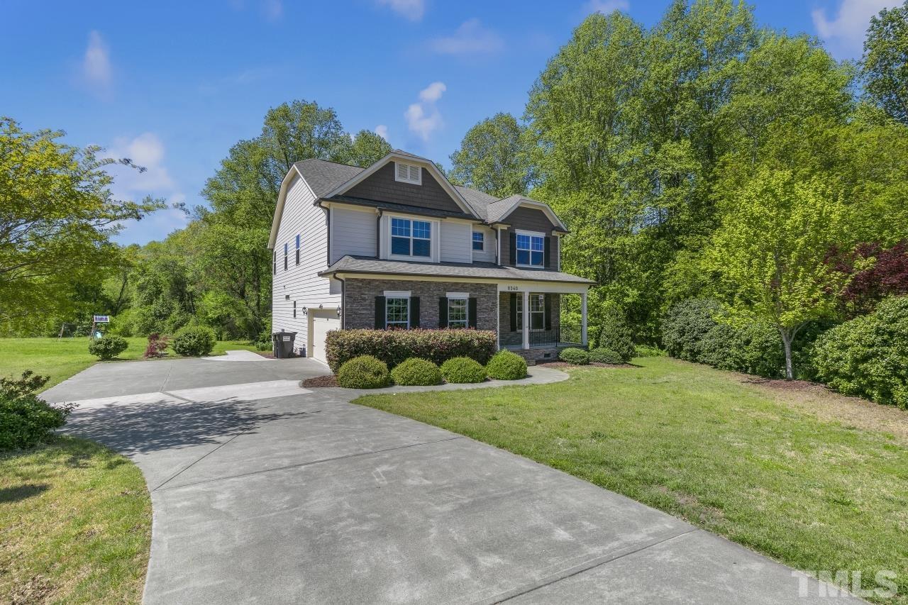 8340 Yellow Aster Court Willow Spring, NC 27592 - Photo 2 of 35 a front view of a house with a yard