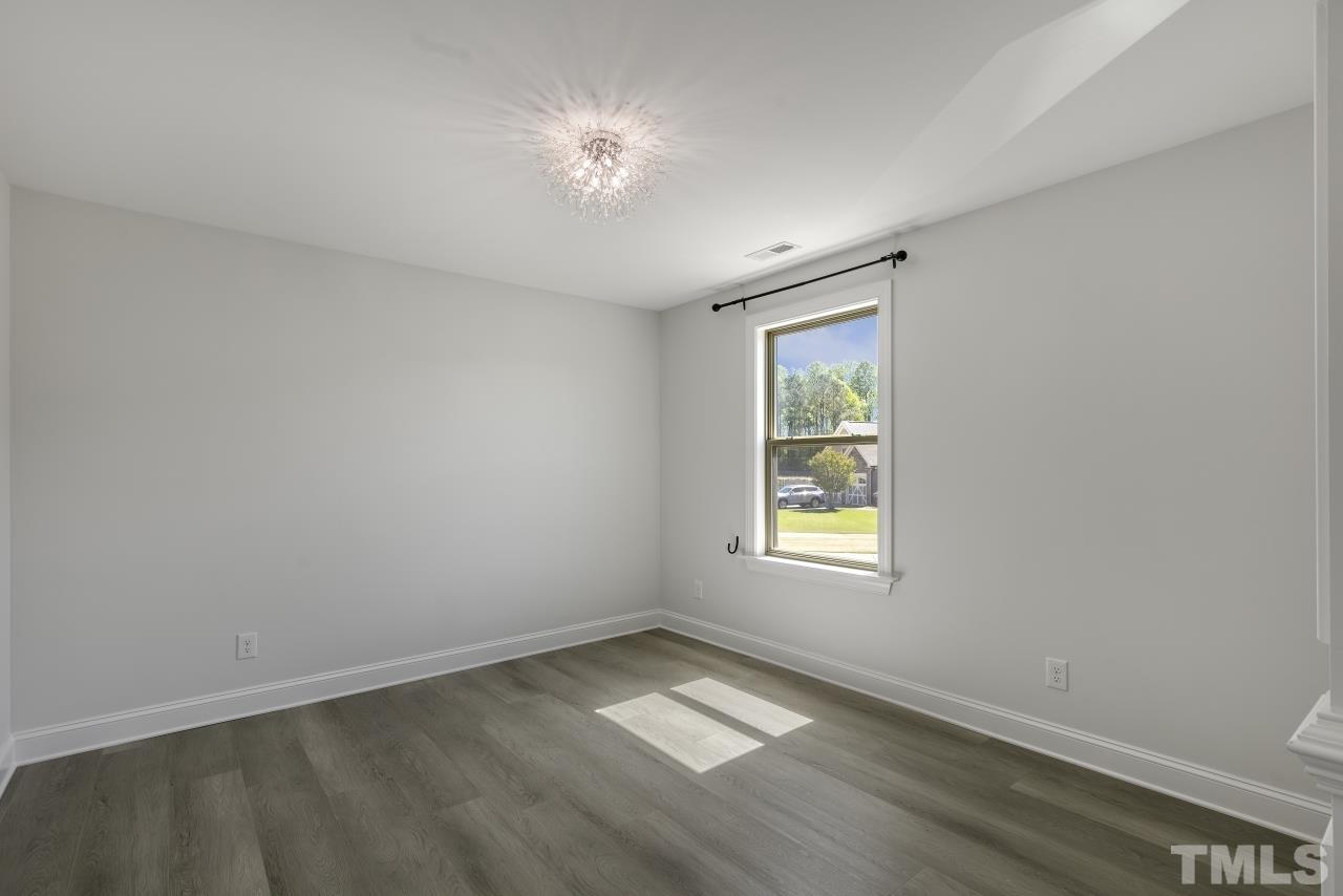 8340 Yellow Aster Court Willow Spring, NC 27592 - Photo 22 of 35 an empty room with a window