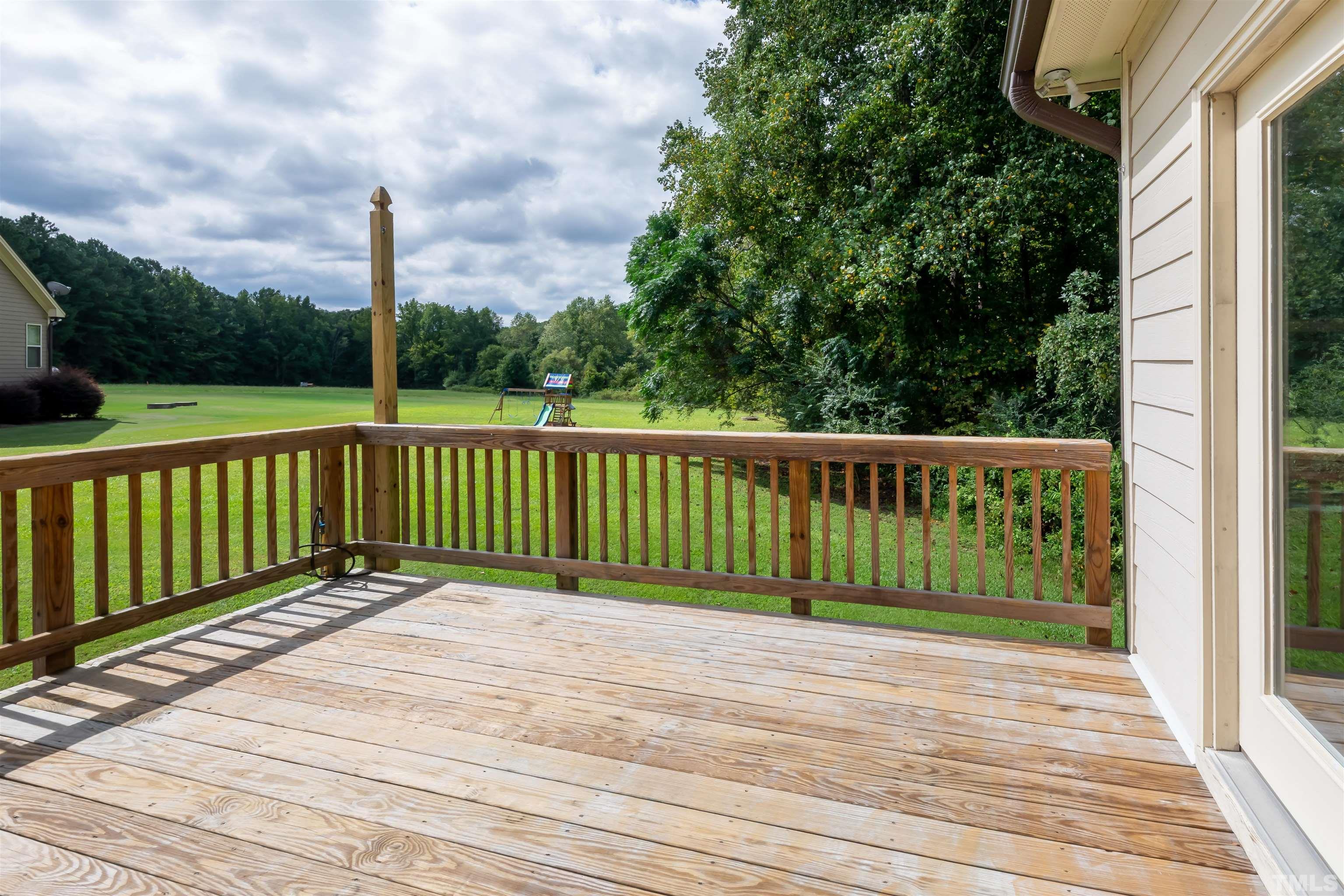 8340 Yellow Aster Court Willow Spring, NC 27592 - Photo 30 of 35 a view of a wooden deck